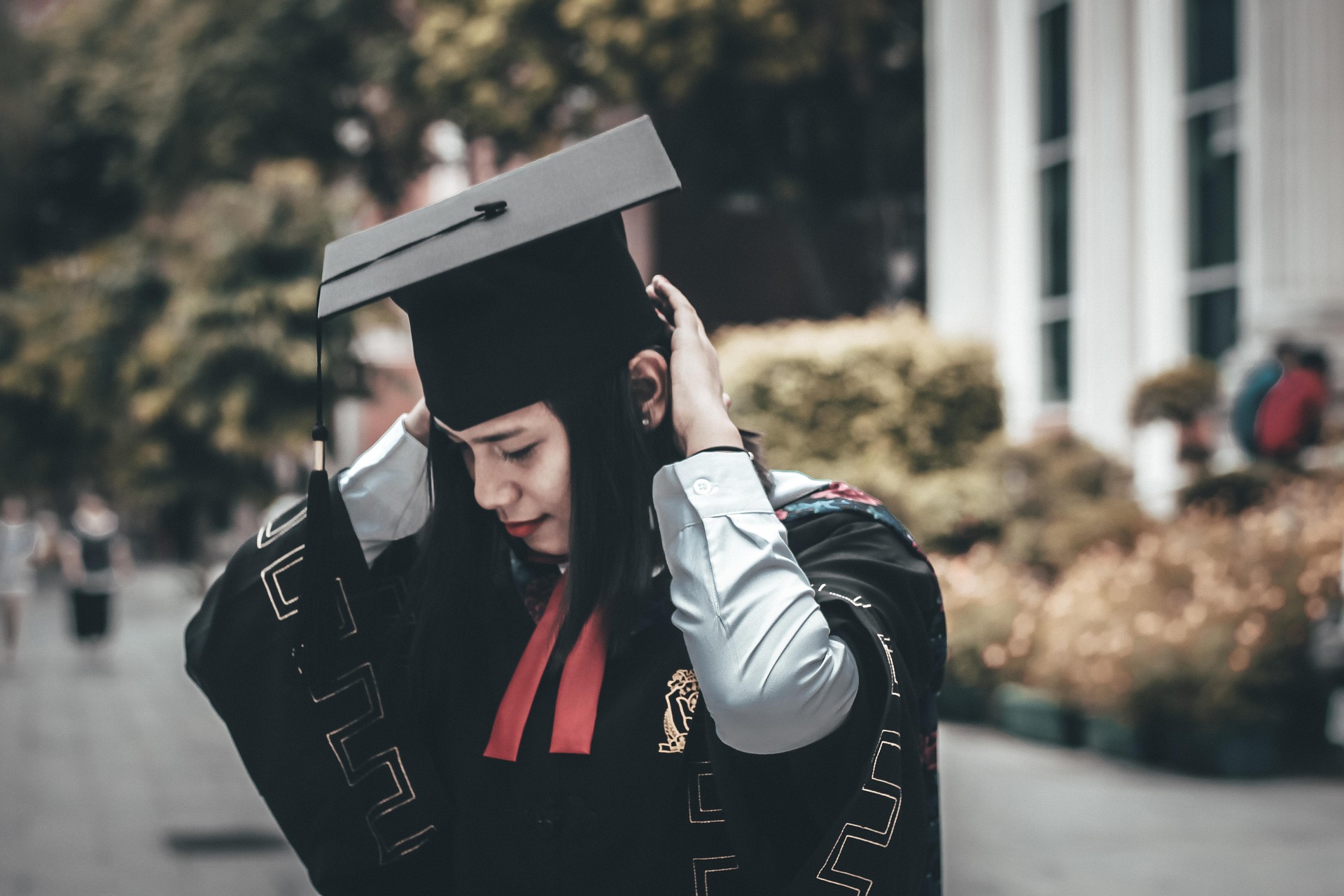 A smiling student looking thoughtfully towards her future